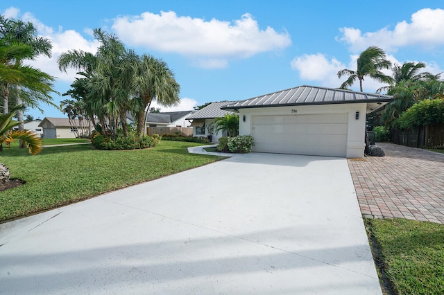 single story home with a garage and a front yard