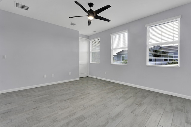 spare room with ceiling fan and light hardwood / wood-style flooring