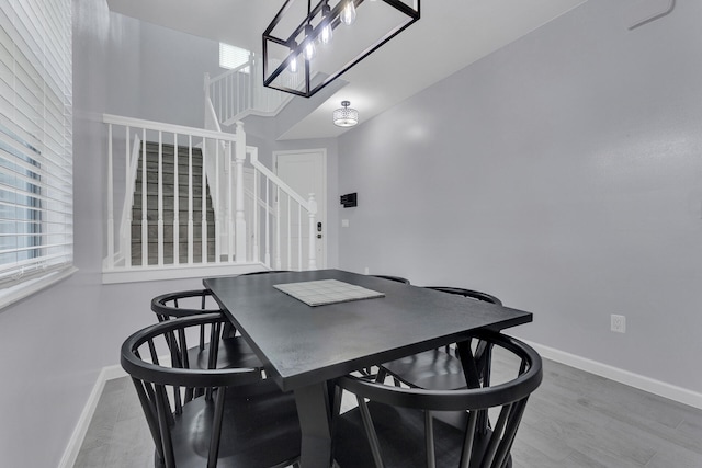 dining area with wood-type flooring