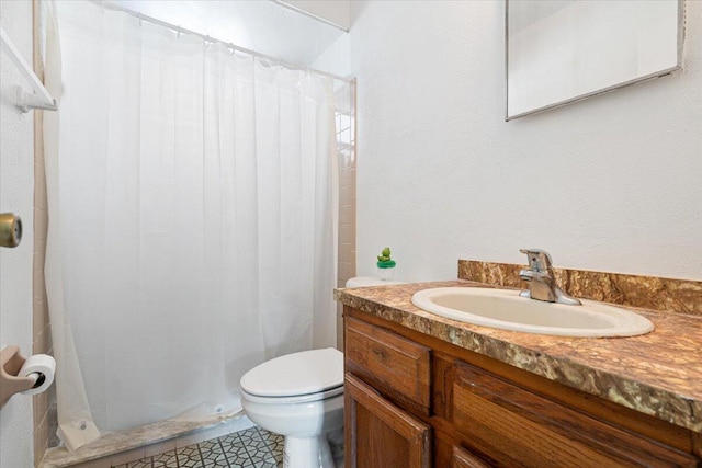 bathroom with vanity, toilet, tile patterned floors, and curtained shower