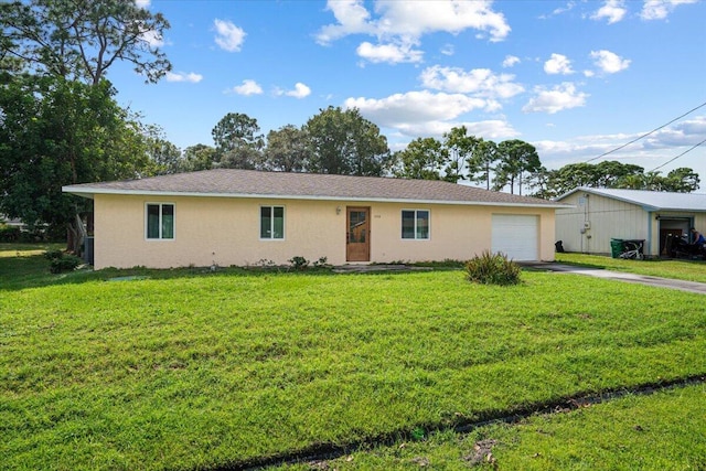 ranch-style home featuring a front lawn and a garage