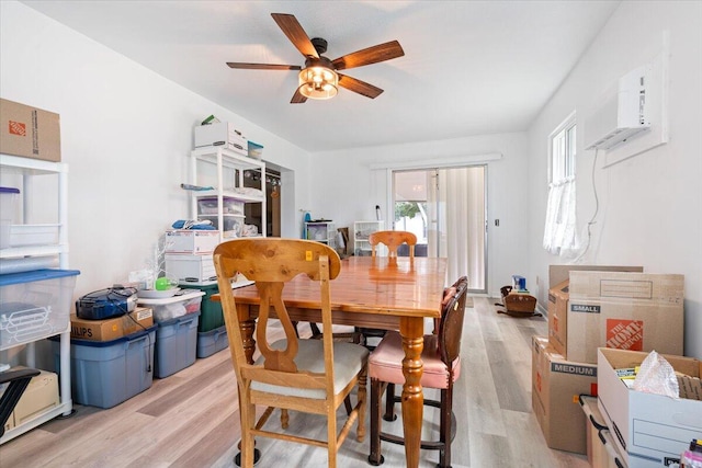 dining space featuring light hardwood / wood-style floors and ceiling fan