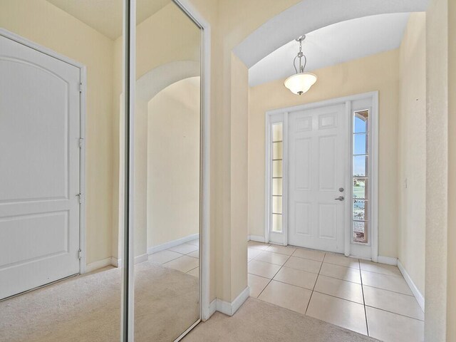 entrance foyer with light carpet