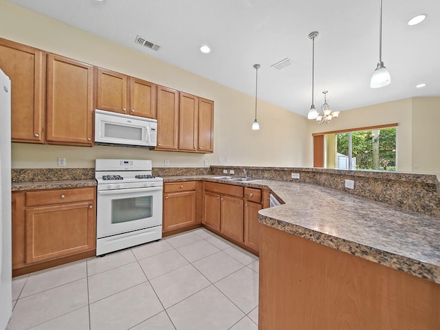 kitchen featuring sink, a notable chandelier, decorative light fixtures, light tile patterned floors, and white appliances