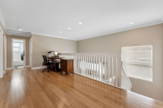 office area with crown molding, light hardwood / wood-style floors, and a baseboard radiator