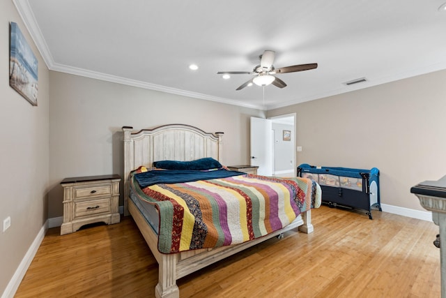 bedroom with ceiling fan, light hardwood / wood-style flooring, and crown molding