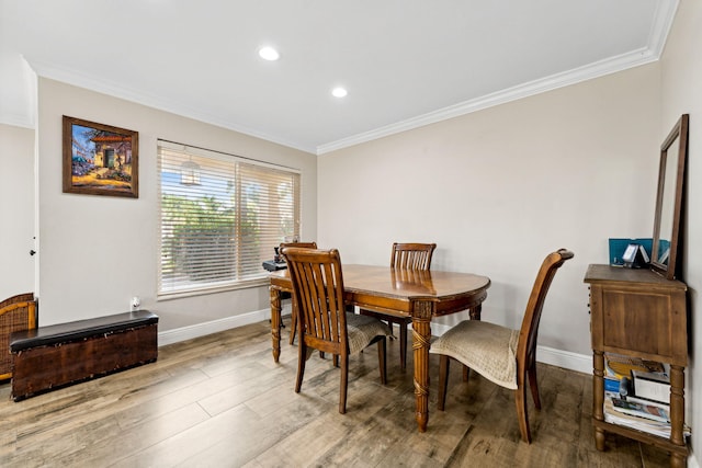 dining area with crown molding and wood-type flooring