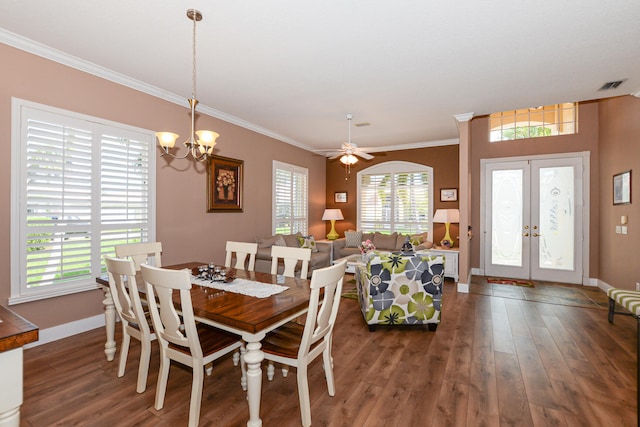 dining space with ornamental molding, a wealth of natural light, french doors, and dark hardwood / wood-style floors