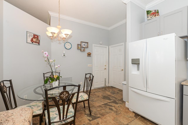 dining room featuring ornamental molding and a chandelier