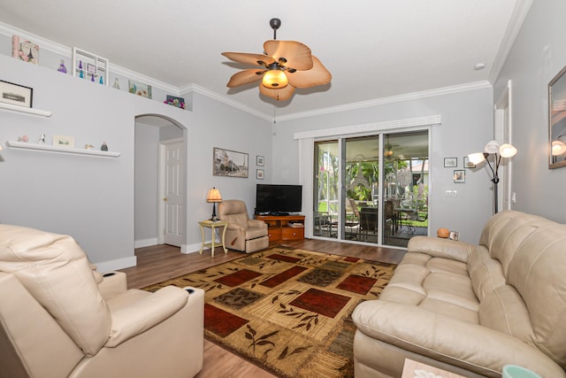 living room featuring ornamental molding, hardwood / wood-style floors, and ceiling fan