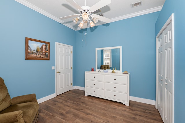 sitting room featuring ornamental molding, dark hardwood / wood-style flooring, and ceiling fan