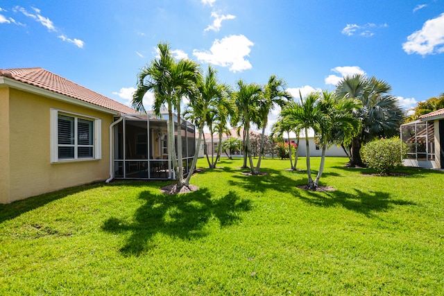 view of yard featuring a lanai