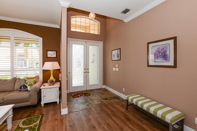 foyer entrance featuring french doors, dark wood-type flooring, and crown molding