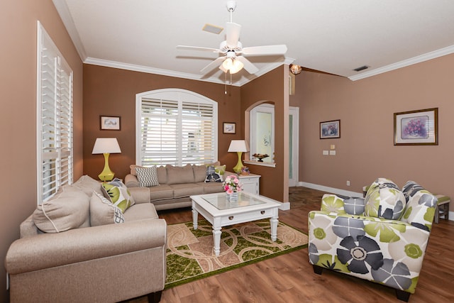 living room featuring ornamental molding, wood-type flooring, and ceiling fan