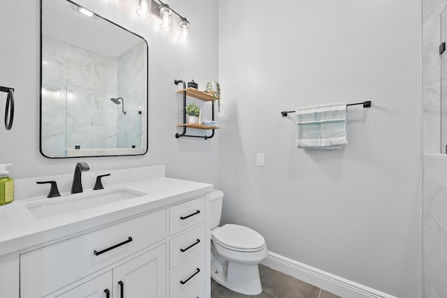 bathroom featuring vanity, tile patterned flooring, toilet, and walk in shower