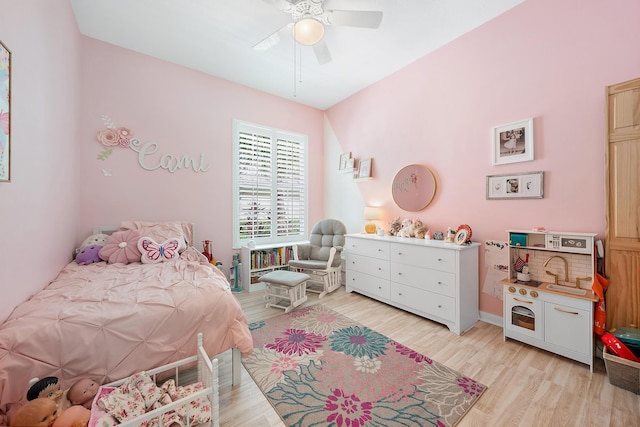 bedroom featuring light wood-type flooring and ceiling fan