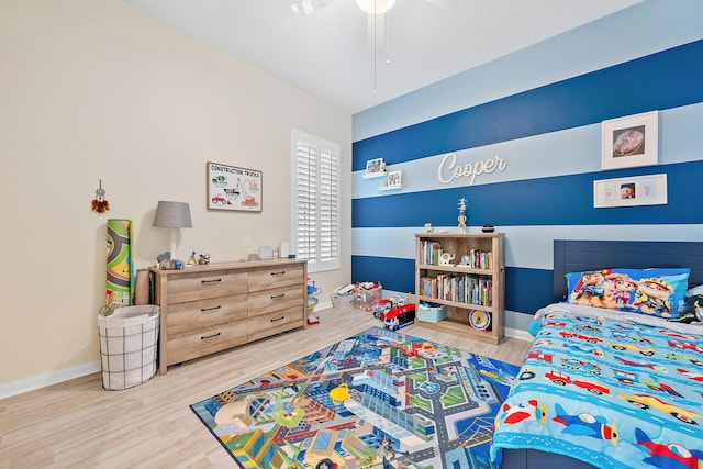 bedroom with wood-type flooring and ceiling fan