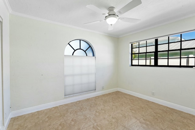 empty room featuring crown molding and ceiling fan