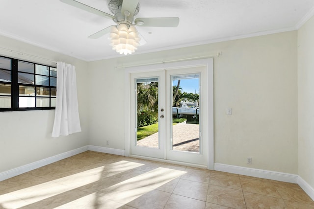 tiled empty room with french doors, ceiling fan, and ornamental molding