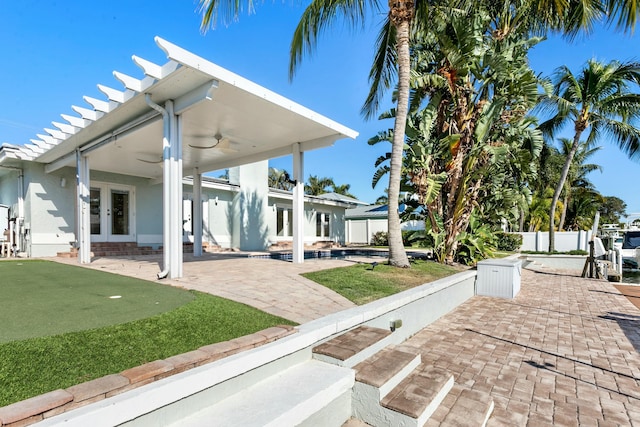 exterior space with ceiling fan and french doors