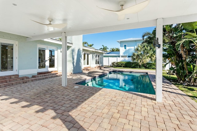 view of pool featuring ceiling fan, french doors, and a patio