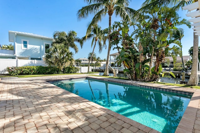 view of swimming pool featuring a patio area