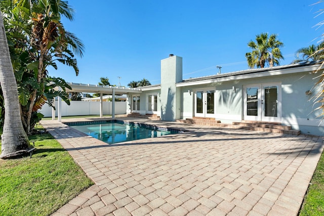 view of pool featuring french doors and a patio