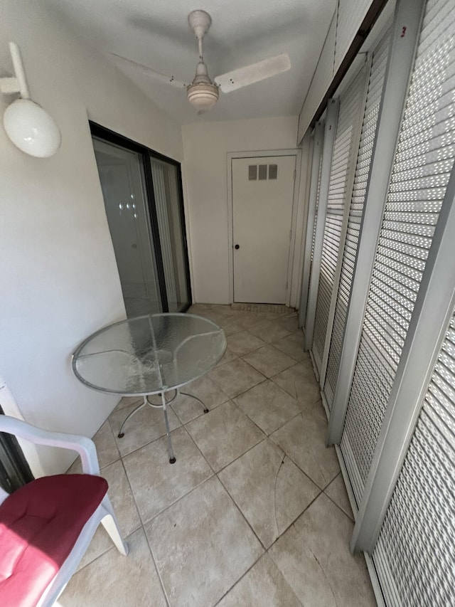 hallway with light tile patterned floors