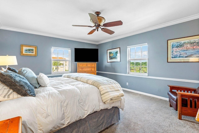 carpeted bedroom featuring crown molding, multiple windows, and ceiling fan