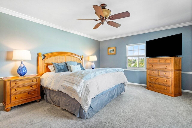 carpeted bedroom featuring ornamental molding and ceiling fan