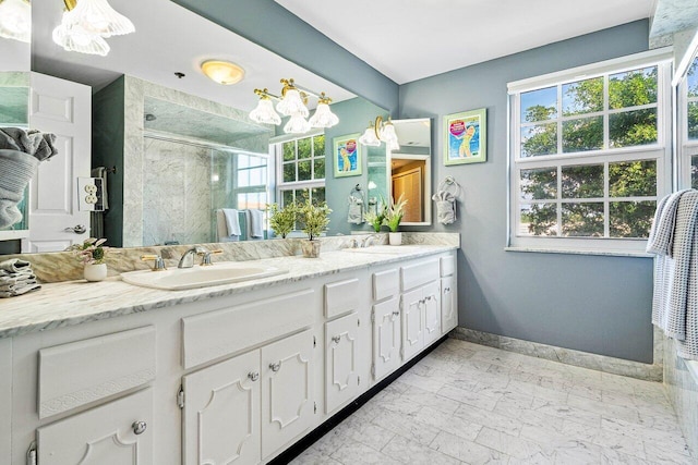 bathroom featuring vanity and an enclosed shower