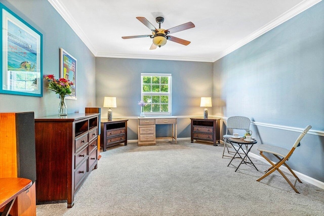 living area with ornamental molding, light colored carpet, and ceiling fan