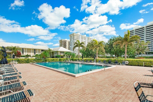 view of swimming pool featuring a patio area