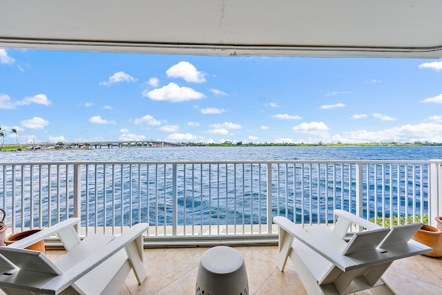 balcony featuring a water view