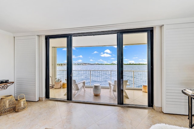 entryway featuring a wall of windows and a water view