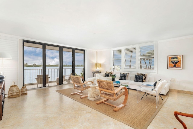 living room with crown molding, a water view, and expansive windows