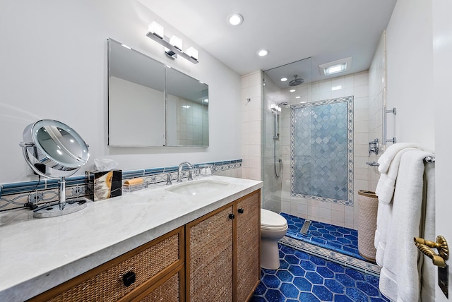 bathroom with vanity, toilet, tile patterned flooring, and an enclosed shower