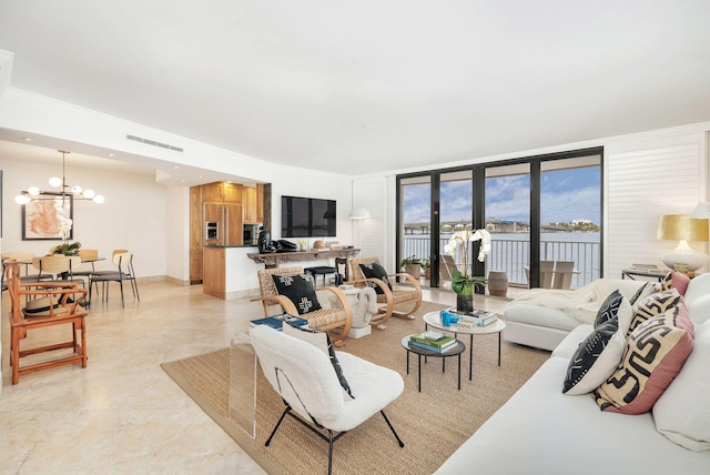 living room with a notable chandelier and floor to ceiling windows