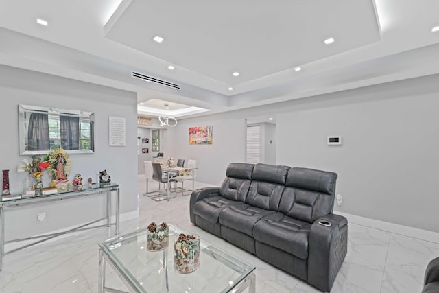 living room with a raised ceiling