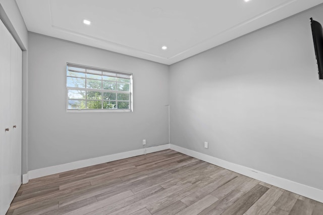 empty room with light hardwood / wood-style floors