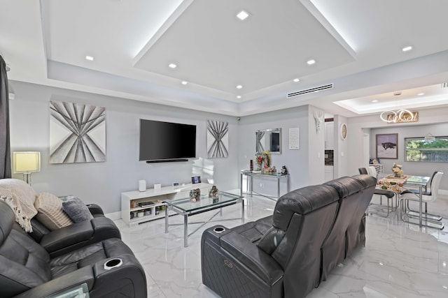 living room featuring a raised ceiling