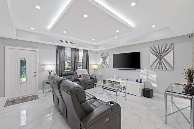 living room with a tray ceiling