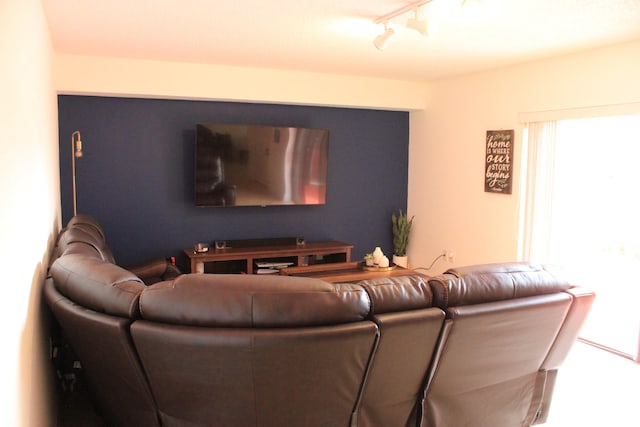 living room featuring rail lighting