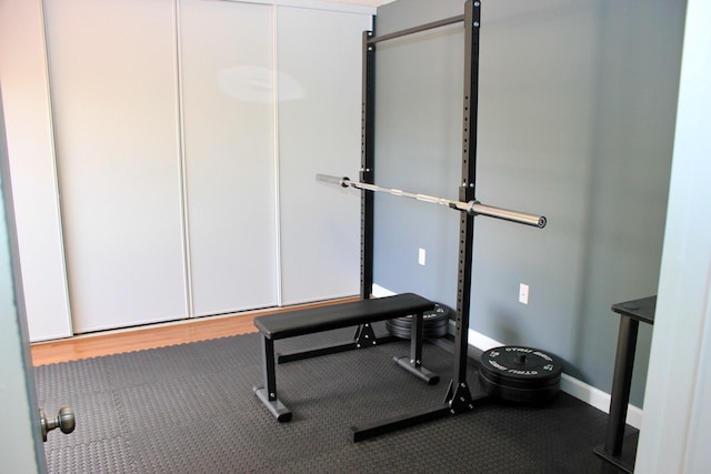 workout area with wood-type flooring