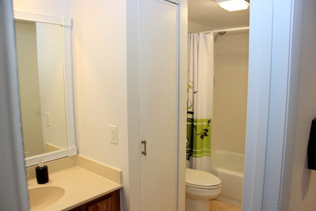 full bathroom featuring toilet, vanity, and shower / bath combination with curtain