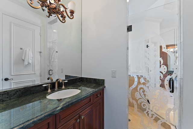 bathroom with vanity, a notable chandelier, crown molding, and a shower with shower door