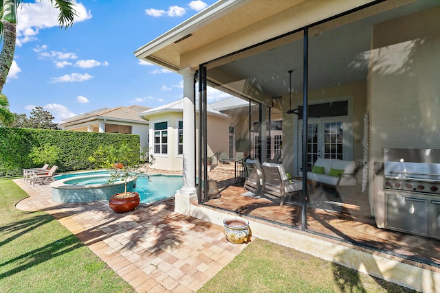 view of pool featuring an in ground hot tub and a patio area