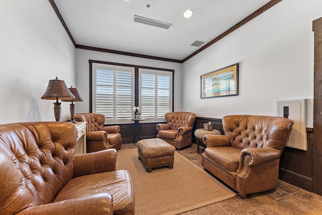 living room featuring crown molding and wooden walls