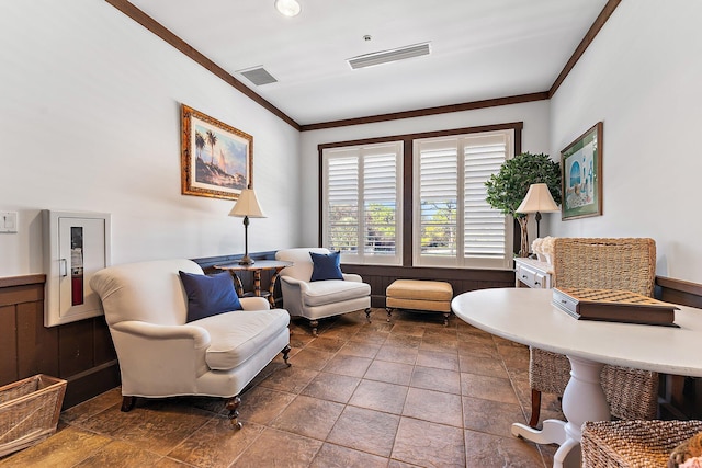 living area with ornamental molding