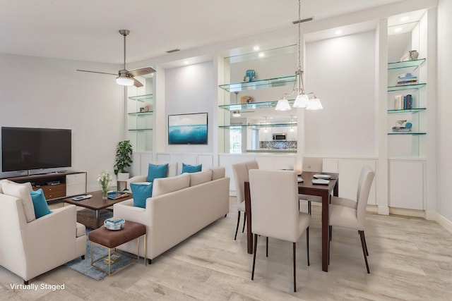 living area with ceiling fan, visible vents, wood finished floors, and recessed lighting